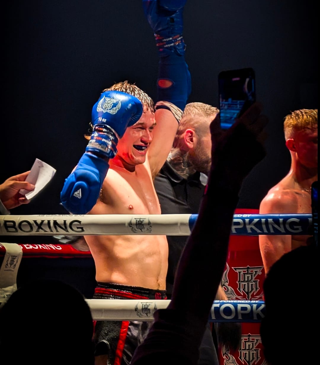 Martynas Bucius celebrating in the ring after his TKO win